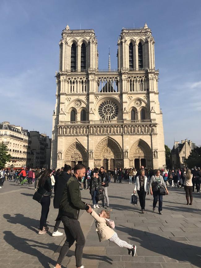 A father and daughter were pictured in front of the Notre Dame before the fire. Picture: Brooke Windsor