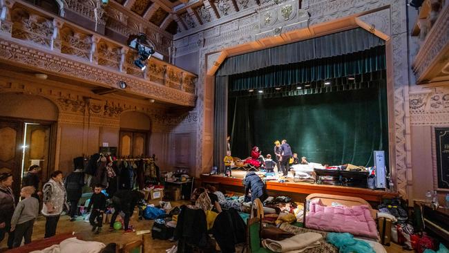 Ukrainian refugees in the theatre of the Ukrainian House, which has been converted into a refuge, in Przemysl, southeastern Poland. Picture: AFP