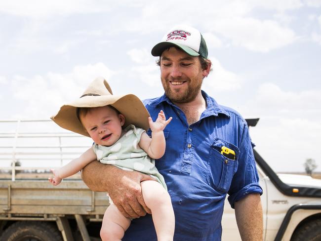 Scott Mudford, pictured with his 11-month-old daughter Fearne, helps run his family sheep and grain farm north west of Dubbo. They have been applying for state and federal government drought assistance. Picture: Dylan Robinson