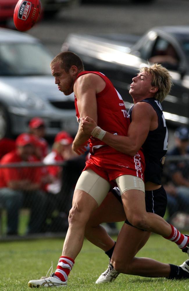 Talia tackling North Adelaide’s Damon White in his early days at South Adelaide after being drafted from Victoria to the Crows.