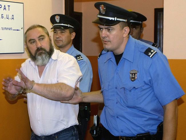 Prison guards escort Damir Dokic to the courtroom for the retrial, in Ruma, northwest of Belgrade, Serbia. Picture: AP