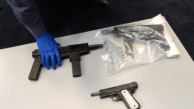 A large-scale weapons production facility, four automatic sub-machine guns and a cache of drugs have been uncovered in raids on two Nerang businesses on the Gold Coast. (AAP Image/Dan Peled)