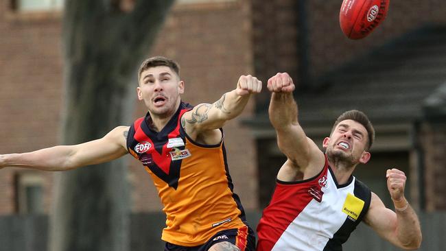 East Keilor’s Charles Van Der Byl and West Coburg’s Marco Serruto contest the footy. Picture: Hamish Blair