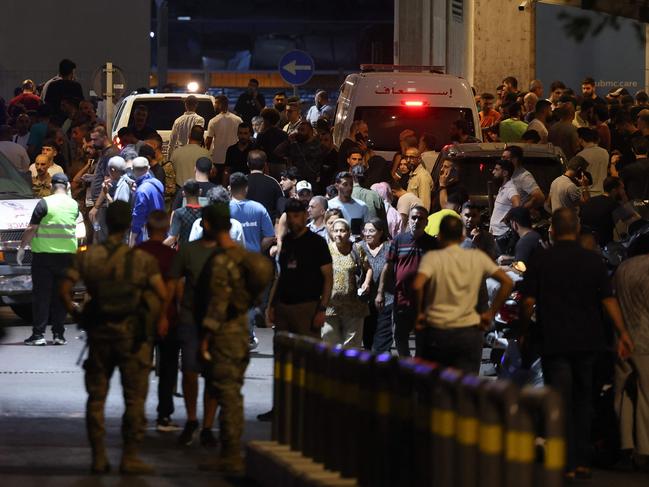 People gather outside a hospital in Beirut after the attack. Picture: AFP