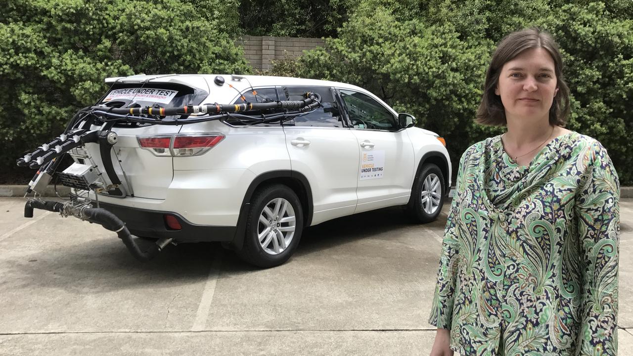 Vehicle emissions expert Natalie Roberts with a Toyota Kluger fitted with test equipment that measures fuel economy and emissions on public roads, rather than in a laboratory. Picture: Joshua Dowling