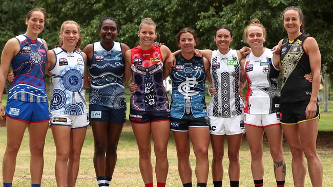 (L-R) Isabel Huntington of the Bulldogs, Mia King of the Kangaroos, Stephanie Williams of the Cats, Maddison Gay of the Demons, Natalie Plane of the Blues, Aliesha Newman of the Magpies, Tilly Lucas-Rodd of the Saints and Harriet Cordner of the Tigers pose during the AFLW indigenous Round last year.