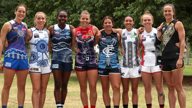 (L-R) Isabel Huntington of the Bulldogs, Mia King of the Kangaroos, Stephanie Williams of the Cats, Maddison Gay of the Demons, Natalie Plane of the Blues, Aliesha Newman of the Magpies, Tilly Lucas-Rodd of the Saints and Harriet Cordner of the Tigers pose during the AFLW indigenous Round last year.