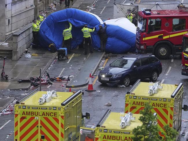 Police and emergency personnel deal with the aftermath of a car ploughing into a group of pedestrians in Liverpool Picture: AP