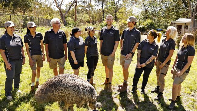 Hills Wildlife Sanctuary CEO Ben Dessen (fifth from right) with volunteers and Moo the emu. Picture: Sam Ruttyn