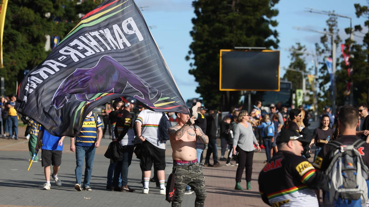 Fans streamed into Accor Stadium in daylight hours for the grand final, but the decider kicked off under lights. Picture: David Swift