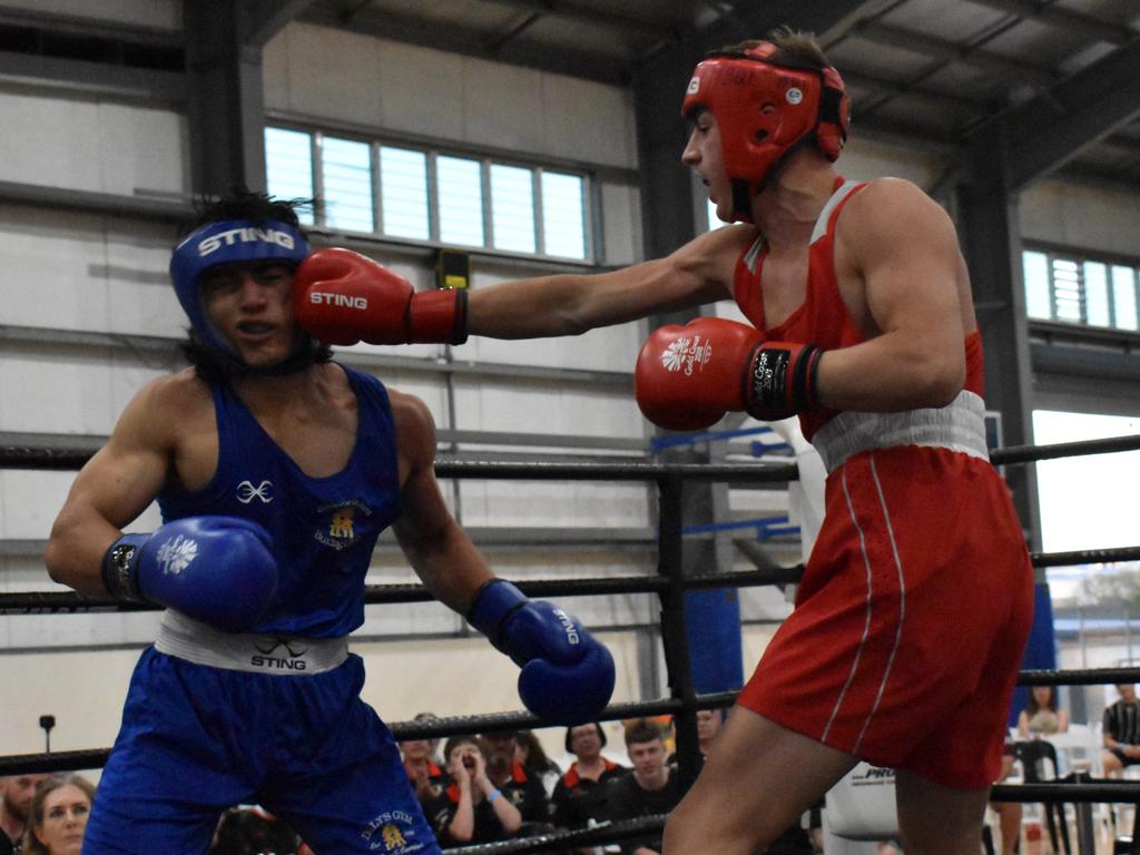 Gladstone's Te Rori Waters Shelford (blue) and Geale Fitness's Blair Geraghty at the Reef 'n' Beef Fight Night, Bravus Arena, Rockhampton, on October 21, 2023.