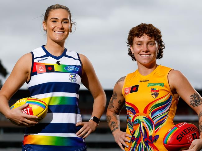 MELBOURNE, AUSTRALIA - NOVEMBER 01: Rebecca Webster of the Cats and Tilly Lucas-Rodd of the Hawks pose for a photo during the launch of the 2023 NAB AFLW Pride Round at Ikon Park on November 01, 2023 in Melbourne, Australia. (Photo by Dylan Burns/AFL Photos via Getty Images)