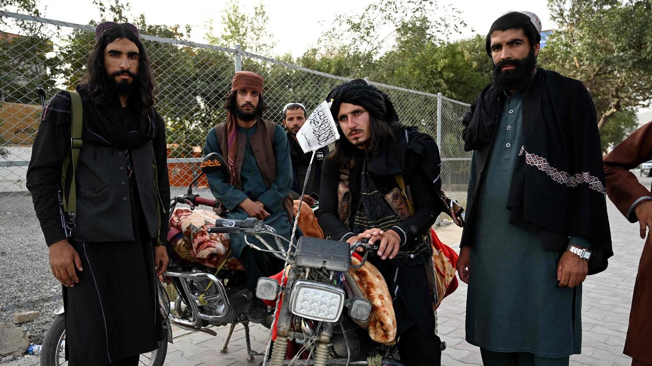 Taliban fighters alongside a Kabul road. Picture: Wakil Kohsar/AFP