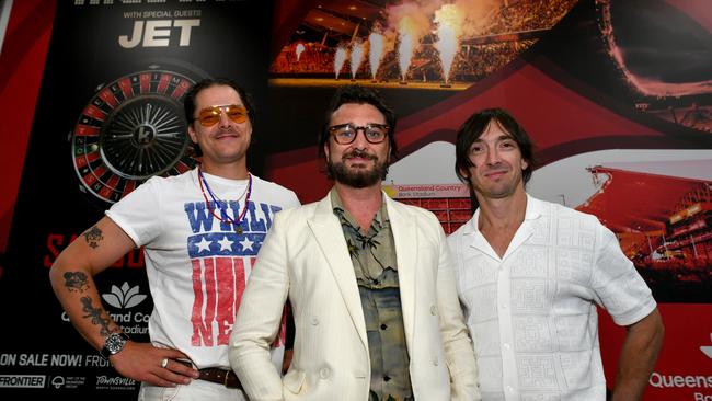 Mark Wilson, Nic Cester and Cam Muncey from Jet arrive at Townsville Airport. Picture: Evan Morgan