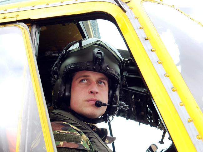 Prince William, the Duke of Cambridge, at the controls of a Sea King helicopter. The Queen is said to be worried about him flying in helicopters. Picture: AP Photo