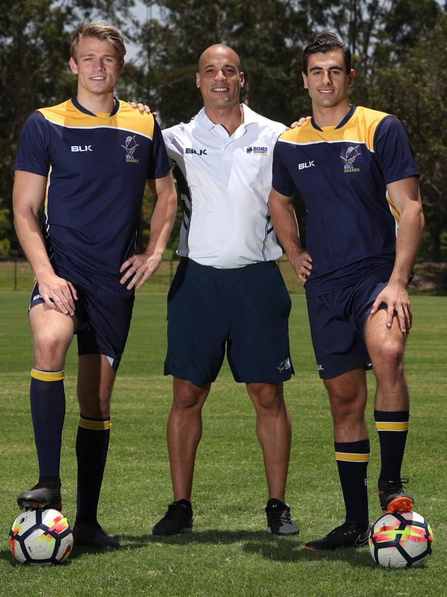 Bond University coach Sean Johnson (centre) with players Aidan Crayton and Joe Allocca. Picture: Glenn Hampson