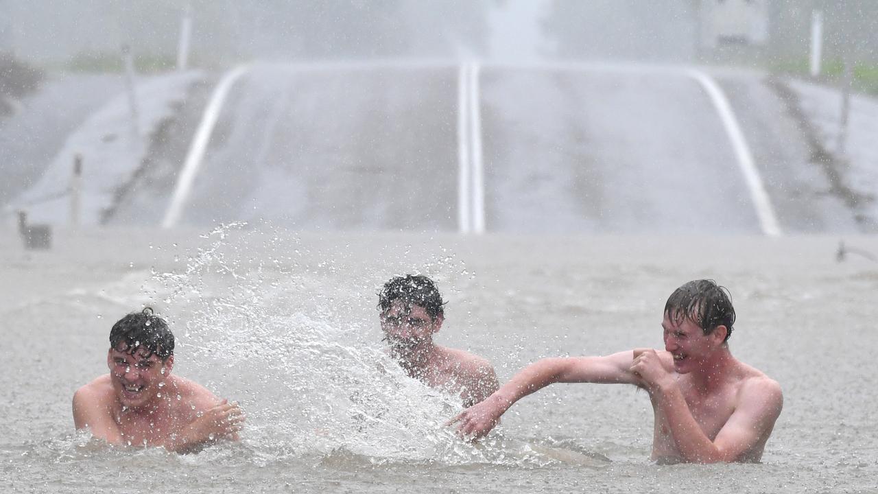 Wet weather in Townsville. Road closed at Allambie Lane, Kelso. Aston Smith, Mitchell Maher and Riley McIntyre. Picture: Evan Morgan