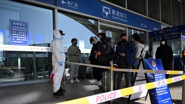 Passengers being stopped at the entrance of a railway station as the city cuts outside transport links and bans residents from leaving, after the largest domestic Covid-19 coronavirus outbreak in six months in Shijiazhaung, in northern China's Hebei province. Picture: AFP