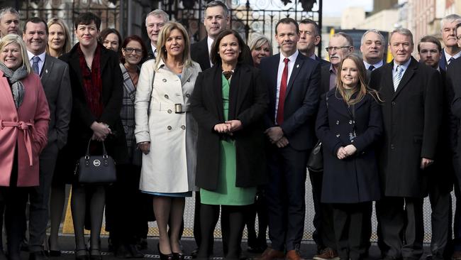 Sinn Fein leader Mary Lou McDonald, centre in green, arrives at Leinster House, Dublin, with MPs. Picture: AP