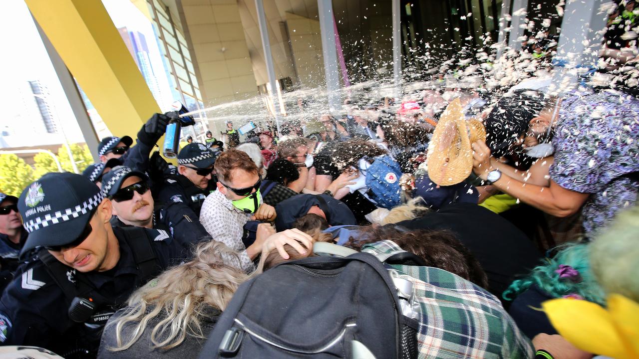 Capsicum spray is used against the crowd. Picture: Stuart McEvoy/The Australian.