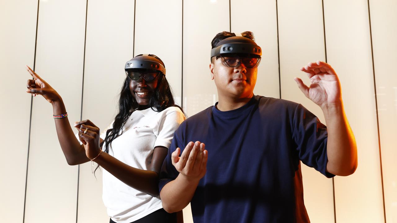 Medical science student Mary Bul and information and communication technology student Don Caspillo using the Microsoft HoloLens at Parramatta. Picture: Richard Dobson