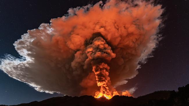 A violent eruption at Mt Etna in Sicily in February 2021 sent lava more than a kilometre in the air. In a massive eruption like Tambora or Krakatoa, the ash cloud could reach as high as 80km. Picture: Getty Images