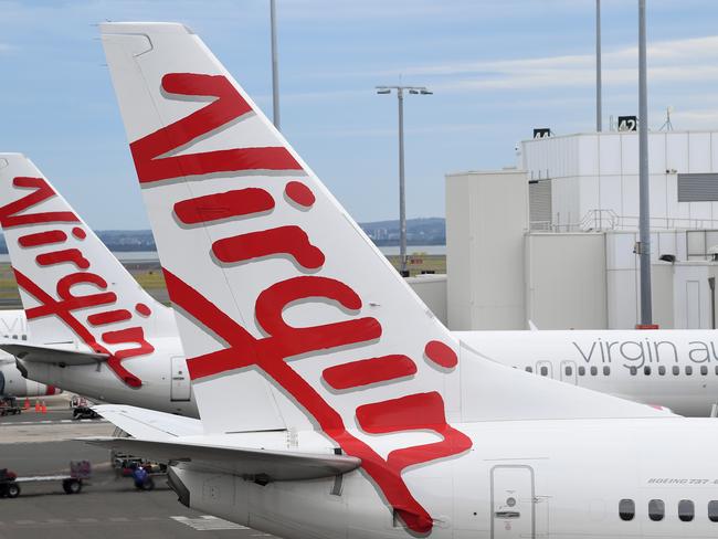 SYDNEY, AUSTRALIA - NCA NewsWire Photos DECEMBER, 18, 2020: A Virgin Australia aircraft at the Domestic terminal at Sydney Airport in Sydney. Picture: NCA NewsWire/Joel Carrett