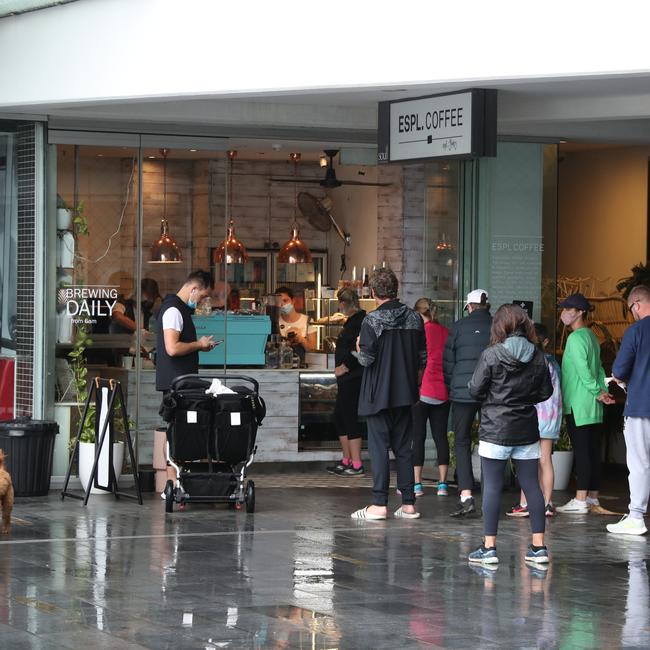 Day three of the Gold Coast lockdown.Large queue for Coffee at Surfers Paradise. . Picture Glenn Hampson