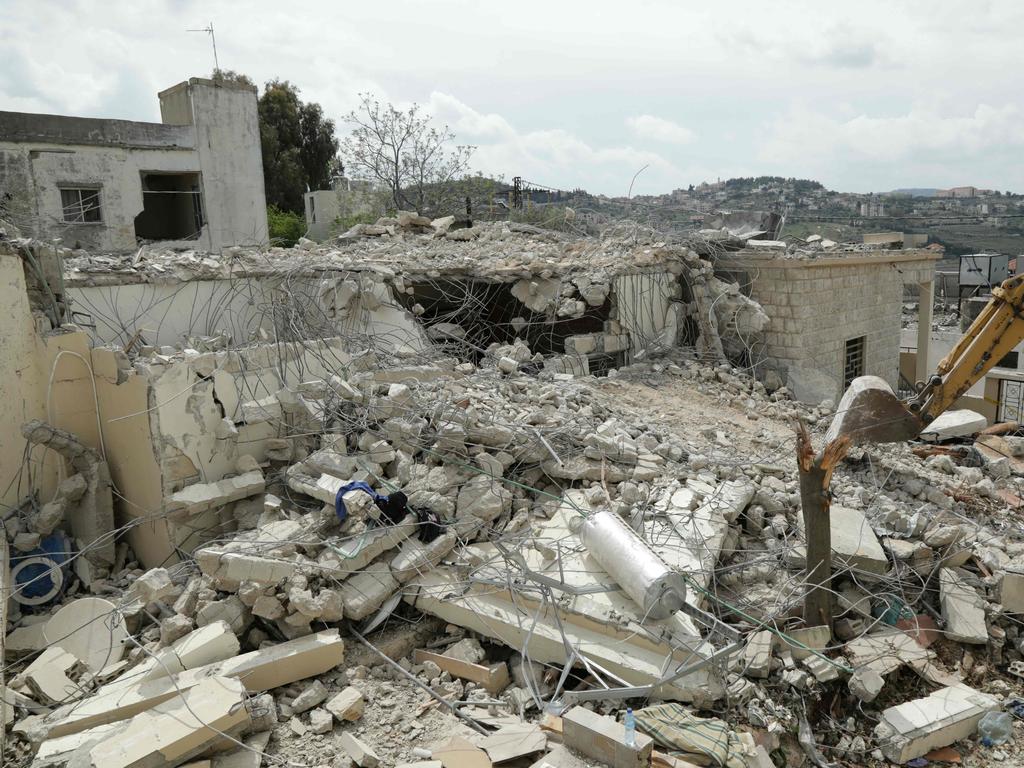 A bulldozer removes rubble from the site of an overnight Israeli strike on a house in the southern Lebanese village of Sultaniyeh. Picture: AFP