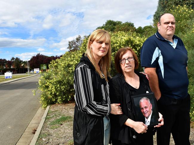 Alma Krecu with her mum Rina Serpo (holding photo frame of her husband Eddie, who was a resident at Oakden and Stewart Johnston outside the facility. Picture: Keryn Stevens