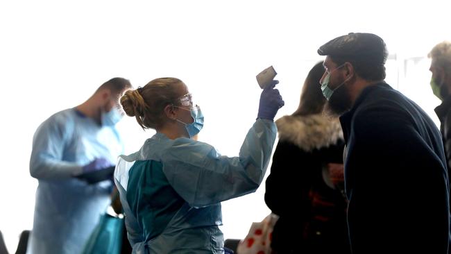 A regular sight at airports from now on: coronavirus screening. Picture: Damian Shaw