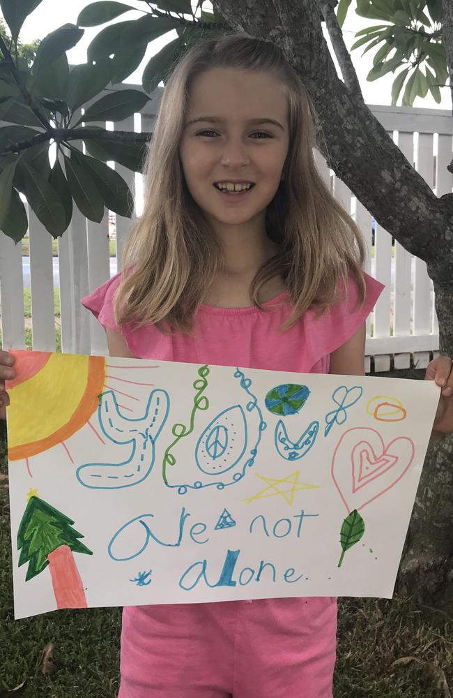 Kaia Walker, 8, of Brighton with a drawing she did for a resident at Regis Aged Care.