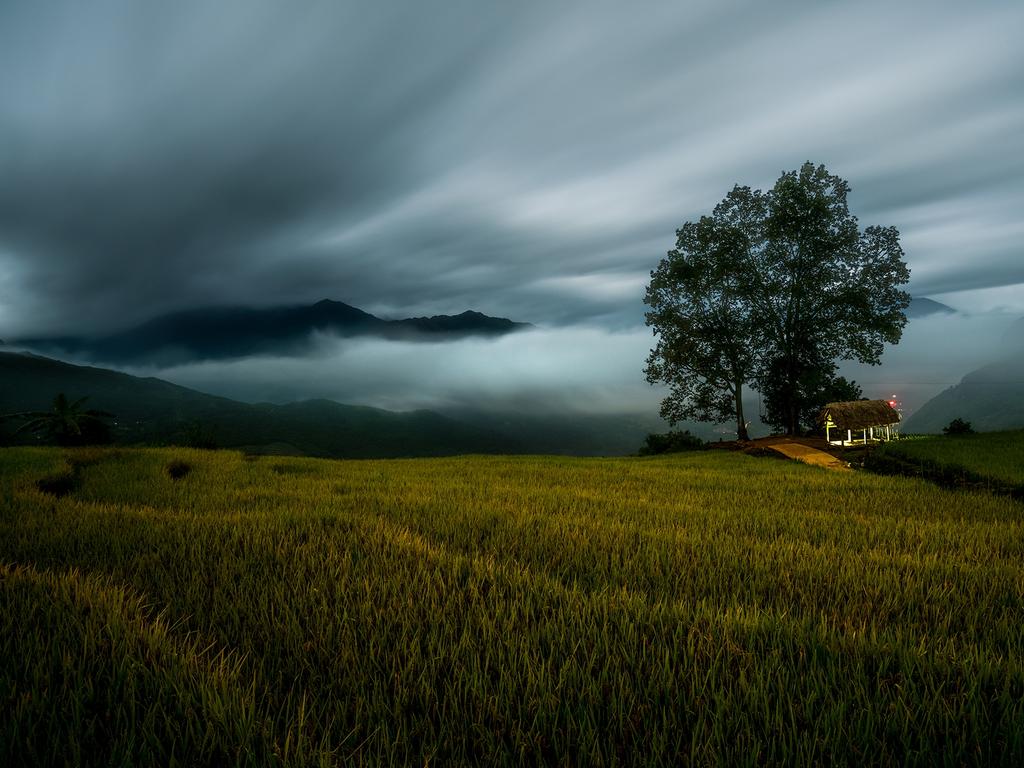 Image Name: Terraced rice field at night Photographer Name: Vinh Dao Year: 2018 Image Description: Terraced rice field at mid night on full moon night with both low clouds and high clouds in Y Ty, Vietnam. Copyright: Vinh Dao, Vietnam, 3rd Place, National Awards. Picture: Sony World Photography Awards/ Vinh Dao