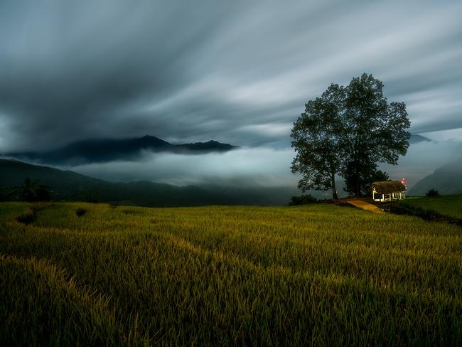 Image Name: Terraced rice field at night Photographer Name: Vinh Dao Year: 2018 Image Description: Terraced rice field at mid night on full moon night with both low clouds and high clouds in Y Ty, Vietnam. Copyright: Vinh Dao, Vietnam, 3rd Place, National Awards. Picture: Sony World Photography Awards/ Vinh Dao
