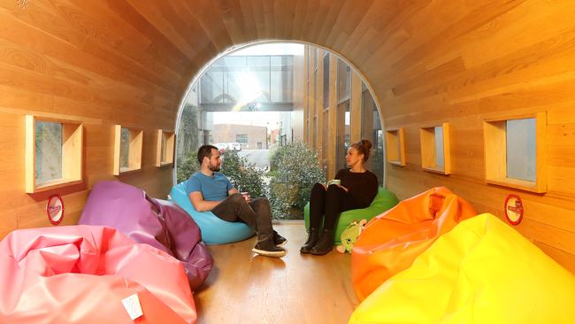 Employees at Moose Toys headquarters enjoy a coffee in the fuselage of an old plane. Picture: Alex Coppel