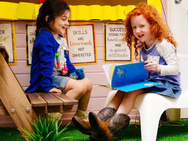 Eloise Cleary and Lucie McDonald (right) hit the books at St Bernadette's Primary School. Picture: Jonathan Ng