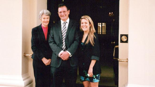 John Schulz with his mother Wanda and daughter Hannah at Government House after receiving the Australian Police Medal in 2008. Picture: Supplied