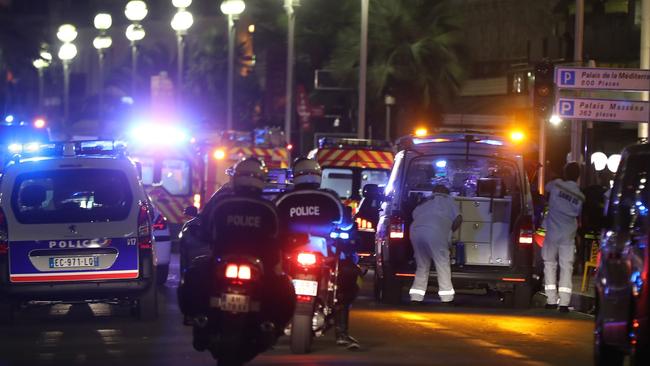 Police officers and rescue workers arrive at the scene in Nice, scene of the latest terror attack. Picture: Valery Hache/AFP