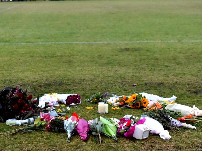 Flowers at the Princes Park soccer pitch where Ms Dixon’s body was found. Picture: Nicole Garmston