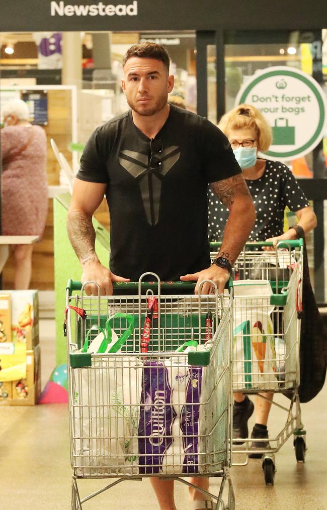 Former Brisbane Bronco Darius Boyd is caught up in the panic buying at Woolworths Gasworks in Brisbane’s Newstead. Picture: Liam Kidston