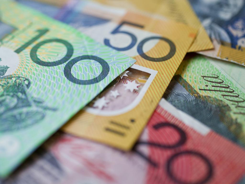 Australian money background showing $100, $50 and $20 notes with a shallow depth of field.