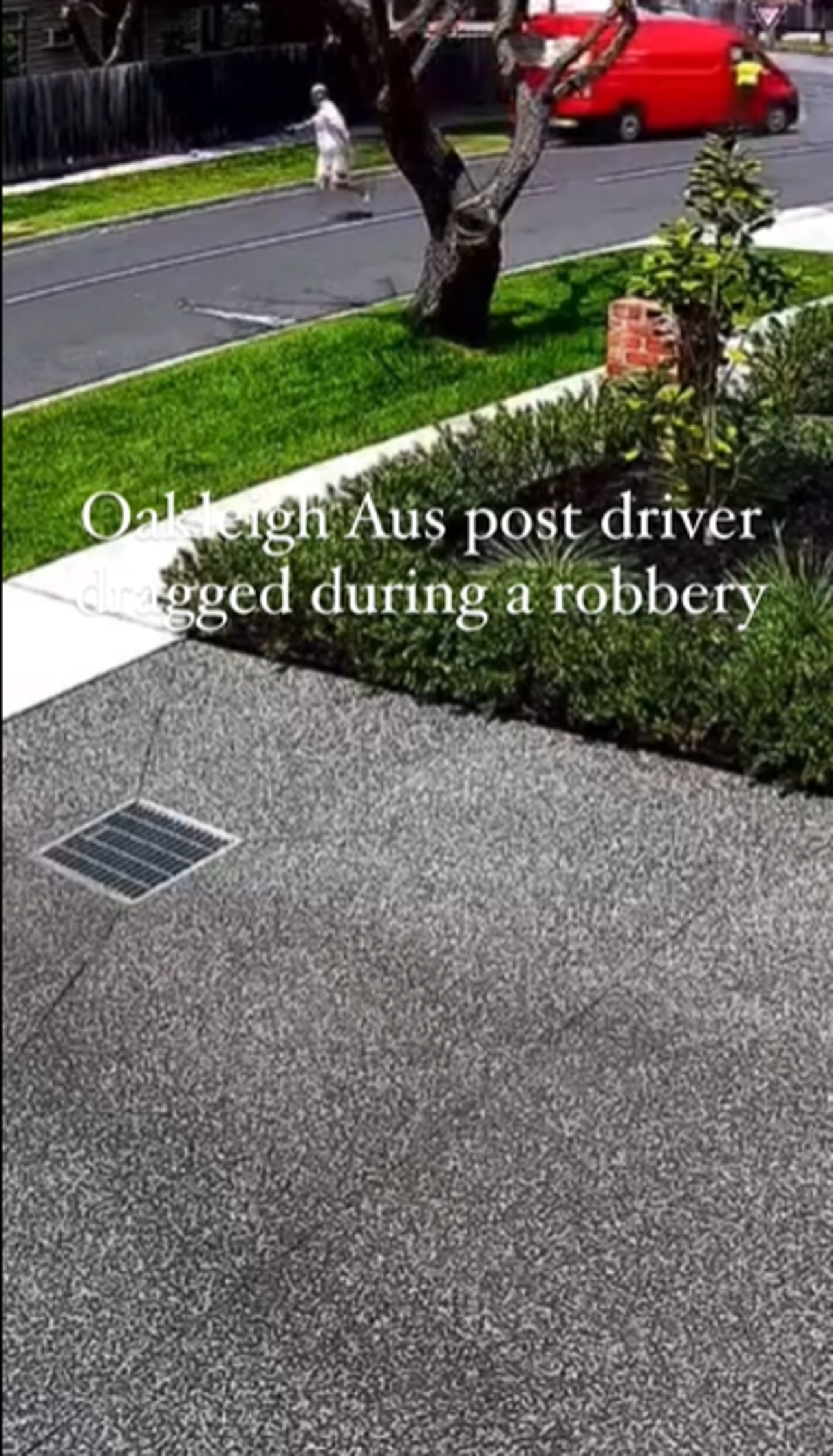 Screen shot of the post man reaching into his stolen van as the thief drives off. Picture: 3AW