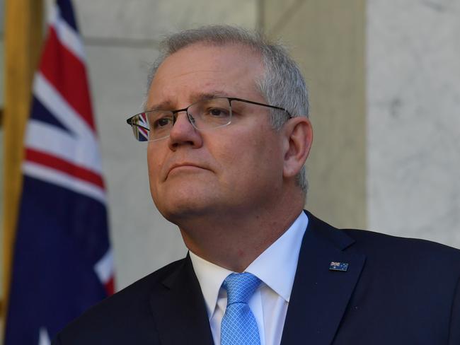 CANBERRA, AUSTRALIA - DECEMBER 11: Prime Minister Scott Morrison reacts during a press conference in the Prime Ministers courtyard on December 11, 2020 in Canberra, Australia. Clinical trials of a COVID-19 vaccine being developed by the University of Queensland in partnership with biotech company CSL will be abandoned, after the Federal Government had committed to purchasing, and agreements had been made to secure 51 million doses of the vaccine. (Photo by Sam Mooy/Getty Images)