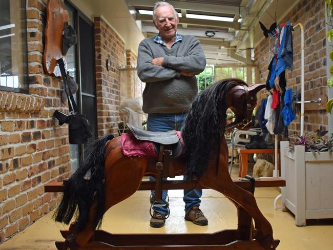 Neil Stuart makes rocking horses and wooden cars at his home in Evans Head