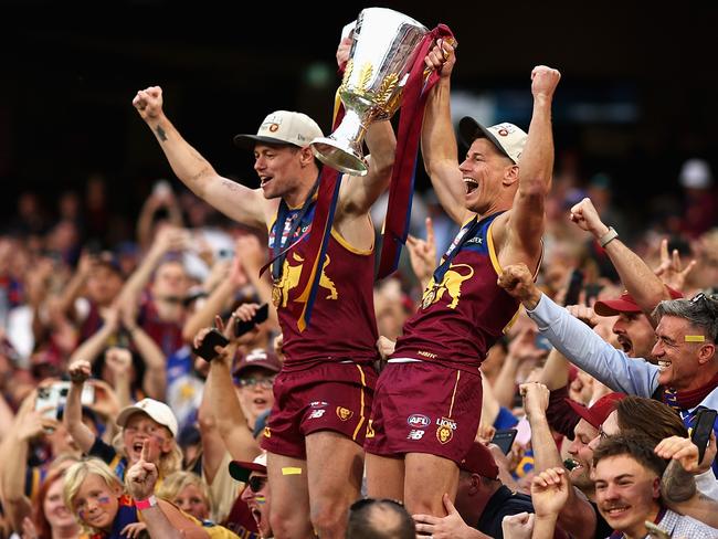 Lachie Neale and Dayne Zorko of the Lions celebrate with the AFL Premiership Cup. Picture: Getty Images