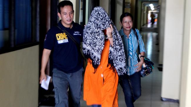 Police take Sara Connor away to be fingerprinted. Picture: Lukman S Bintoro