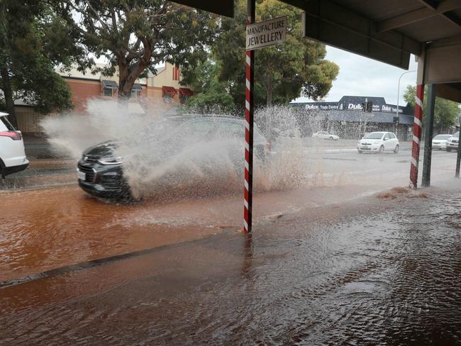 A burst water main on Henley Beach Road, Mile End, in November. Picture: AAP / Dean Martin