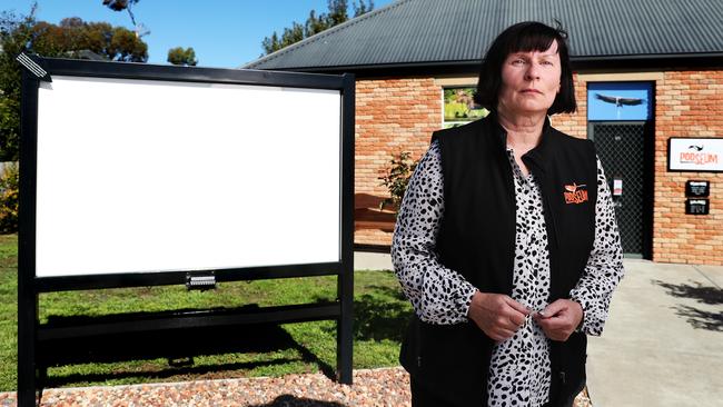 Karin Koch with the blank white sign outside her Pooseum at Richmond. Picture: Nikki Davis-Jones