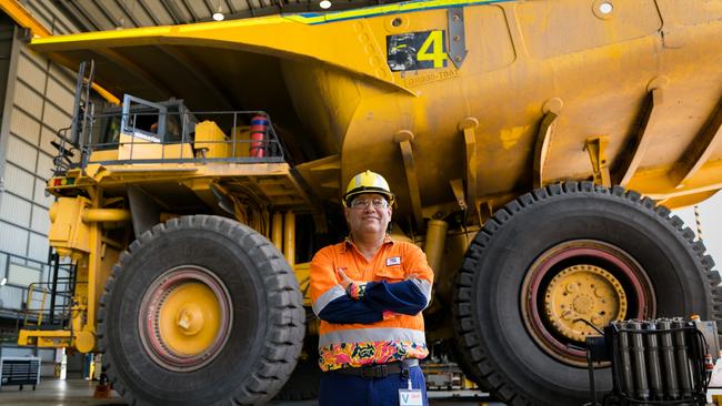 BHP Minerals Australia President Edgar Basto in front of a Komatsu haul truck at Goonyella Riverside Mine. Mr Basto announced BHP’s vaccine mandate in October 2021.