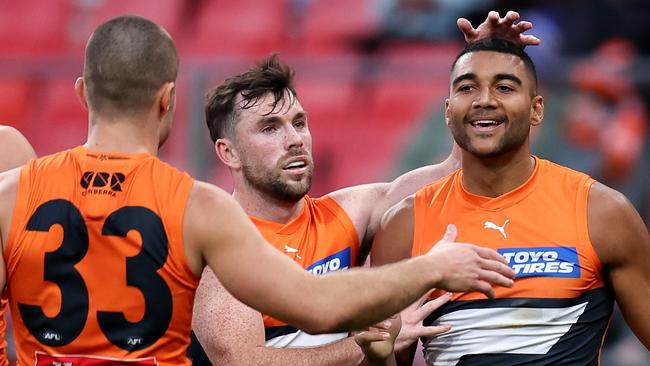 SYDNEY, AUSTRALIA - JUNE 16: Callum M. Brown of the Giants celebrates kicking a goal with team mates during the round 14 AFL match between Greater Western Sydney Giants and Port Adelaide Power at ENGIE Stadium, on June 16, 2024, in Sydney, Australia. (Photo by Brendon Thorne/AFL Photos/via Getty Images)